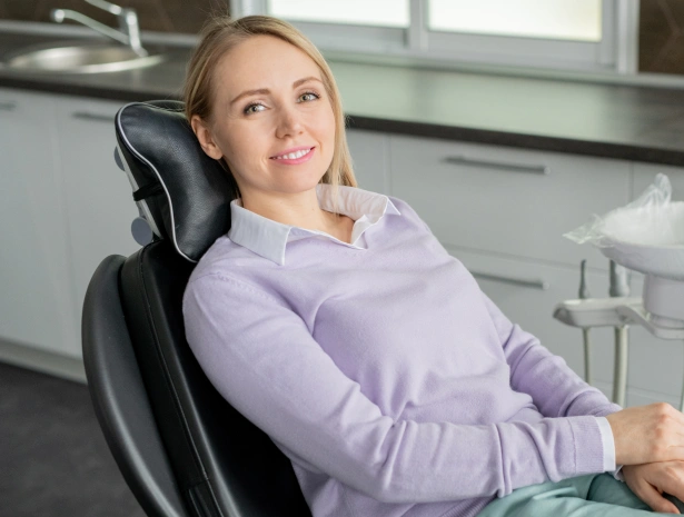 Woman patient seated comfortably in a dental treatment room at Willow Street Dental in Chippewa Falls, WI